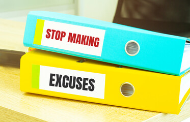 Two office folders with text Stop Making Excuses