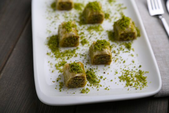 Dolama Baklava with pistachio on a white plate close up