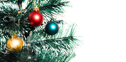 Beautiful Christmas card with a green Christmas tree and frosted balls and an empty space for the inscription or design. Christmas tree with small multicolored balls on a white background.