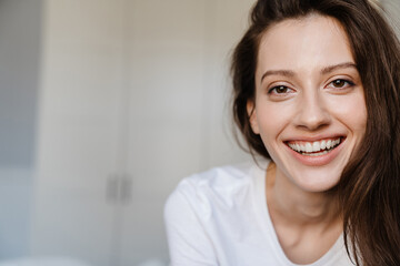 Close-up portrait of an attractive young woman smiling