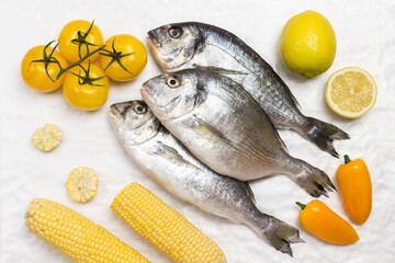 Raw fish with yellow vegetables.