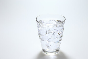 water with ice cubes in glass