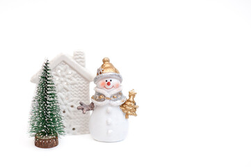 snowman, green tree and white house on a white background.