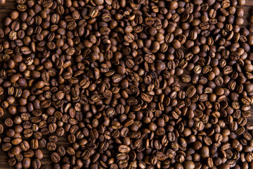Coffee cup with coffee bag on wooden table. View from top,Roasted coffee beans
