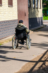 A wheelchair user leaves the photographer.