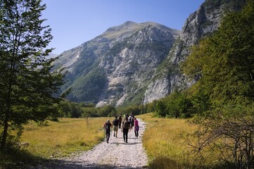 A group of people is going hiking in the mountains (Marche, Italy, Europe)