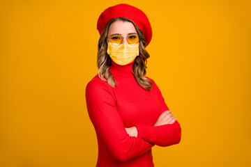Close-up profile side view portrait of her she nice attractive charming pretty wavy-haired girlfriend folded arms wear medical mask isolated on vivid shine yellow color background