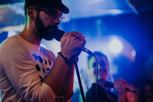 Young man singing on stage