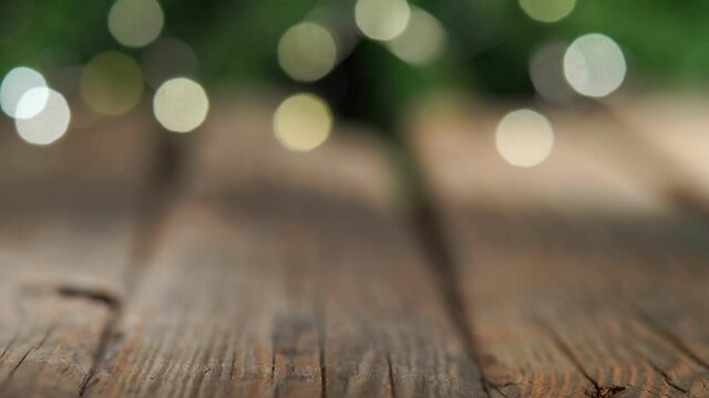 Pan of Gifts on old wooden table, Christmas background, bokeh lights
