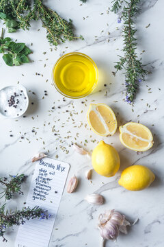 ingredients for a greek flavoured marinade, including lemon, oli