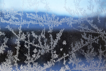 Frost Crystals On A Window On A Dark Winter Morning