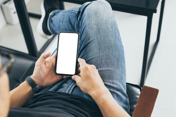 cell phone mockup blank white screen.man hand holding texting using mobile on desk at coffee shop.background empty space for advertise.work people contact marketing business,technology