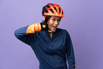 Teenager cyclist girl making phone gesture. Call me back sign