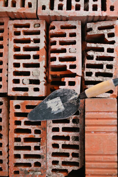 Old bricks and a mason trowel. View from above