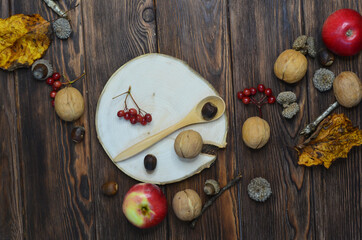 autumn background frame apples acorns rowan walnuts leaves still life top view copy space text