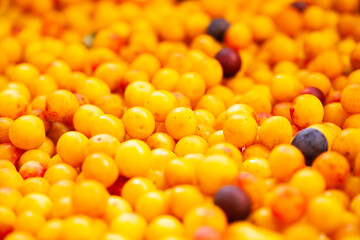 ripe yellow cherry plums on the counter