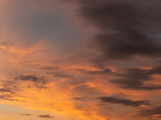 sky during sunset, shades of orange and dramatic clouds