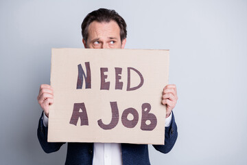 Photo of unhappy worker aged mature guy business man upset financial crisis lost work carton placard hide half facial expression search work moody wear blue suit isolated grey background