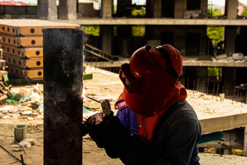 Welder erecting technical steel