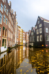Fototapeta na wymiar Beautiful building and canals near Red light and Damrak street in Amsterdam , Netherlands