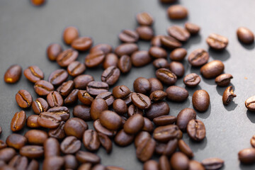 Brown roasted coffee beans seed on dark background