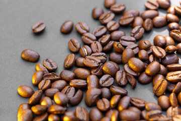 Brown roasted coffee beans seed on dark background