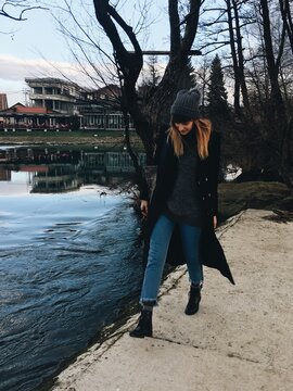 Woman walking by the beautiful river Una in Bihac