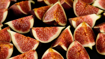 fresh cut figs close up on black background