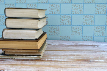 old books stacked on wooden table, retro interior