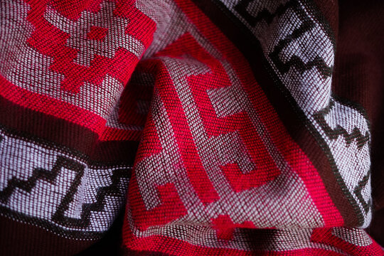 Argentinian colorful poncho gaucho. Warm and cozy. Pattern close up, textile background.
