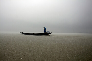 Boat on the water in the rain