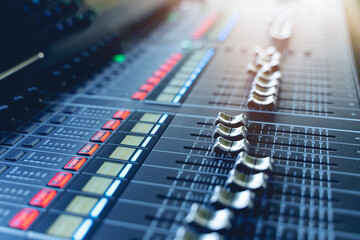 Obraz na płótnie Canvas professional concert mixing console is equipped with high-precision and long-stroke faders. Close-up