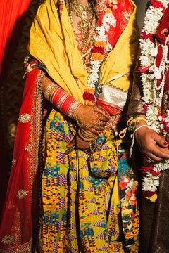 Detail shot of Bride and Groom's hands at an Indian wedding ceremony