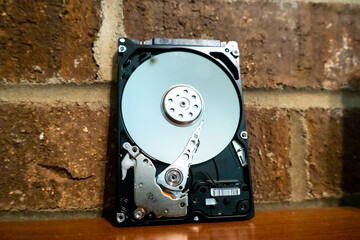 Fototapeta na wymiar internal moving parts and electronics of a typical disc hard drive