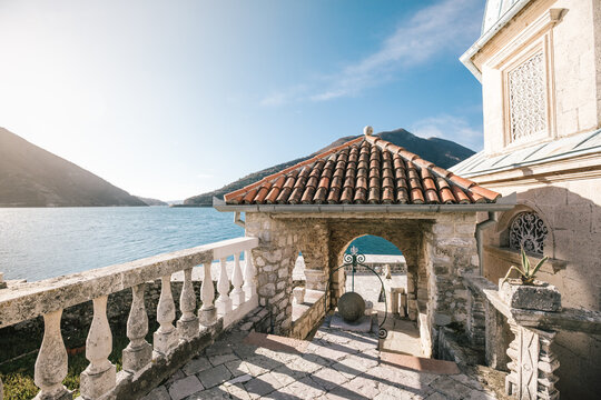 historic mediteranean house at the sea at sunrise, perast, montenegro