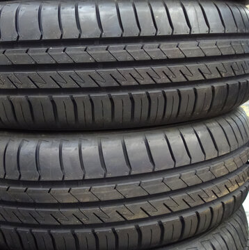 new summer tires for a car, the concept of replacing worn-out rubber or seasonal wheel change on a car