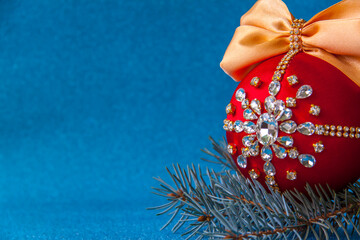 Red ball in rhinestones for Christmas tree decoration.