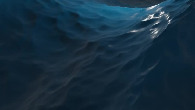 Dark blue ocean surface seen from underwater. Abstract waves underwater and rays of sunlight shining through. 3D animation