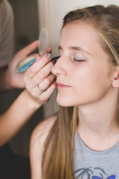 Young girl getting ready for a night out