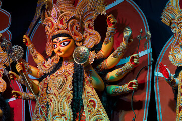Idol of Goddess Durga at decorated Durga Puja pandal , Durga Puja festival at night. Shot under...