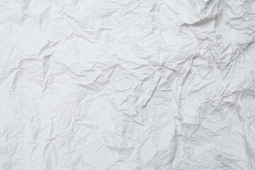 Crumpled white paper background.