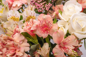 Bouquet of  soft pink flowers in wrapping paper.
