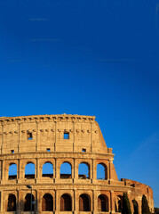 Colosseum in Rome, Italy. Front view against blue sky