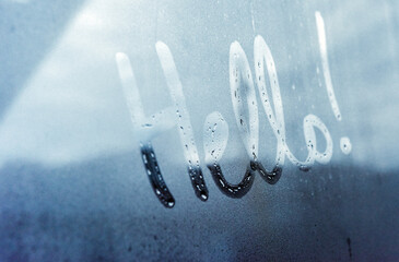 Hello written on a glass