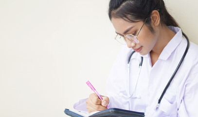Fototapeta premium Medical physician doctor woman, Young doing a record in book concept.
