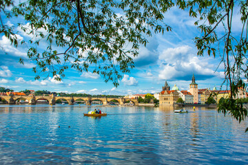 Fototapeta premium The landscape of the city of Prague view from the Vltava river on the ancient architecture of the city
