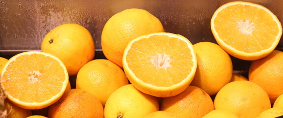 Close up of a group of fresh oranges , soft focus