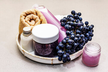 Natural spa accessories with ripe grapes