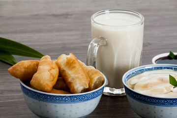 bowl of bean curd or soy pudding with fried dough