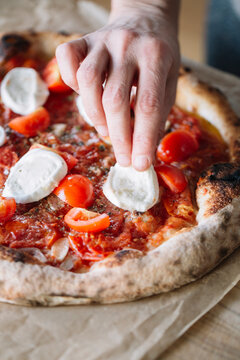 Woman cooking homemade pizza